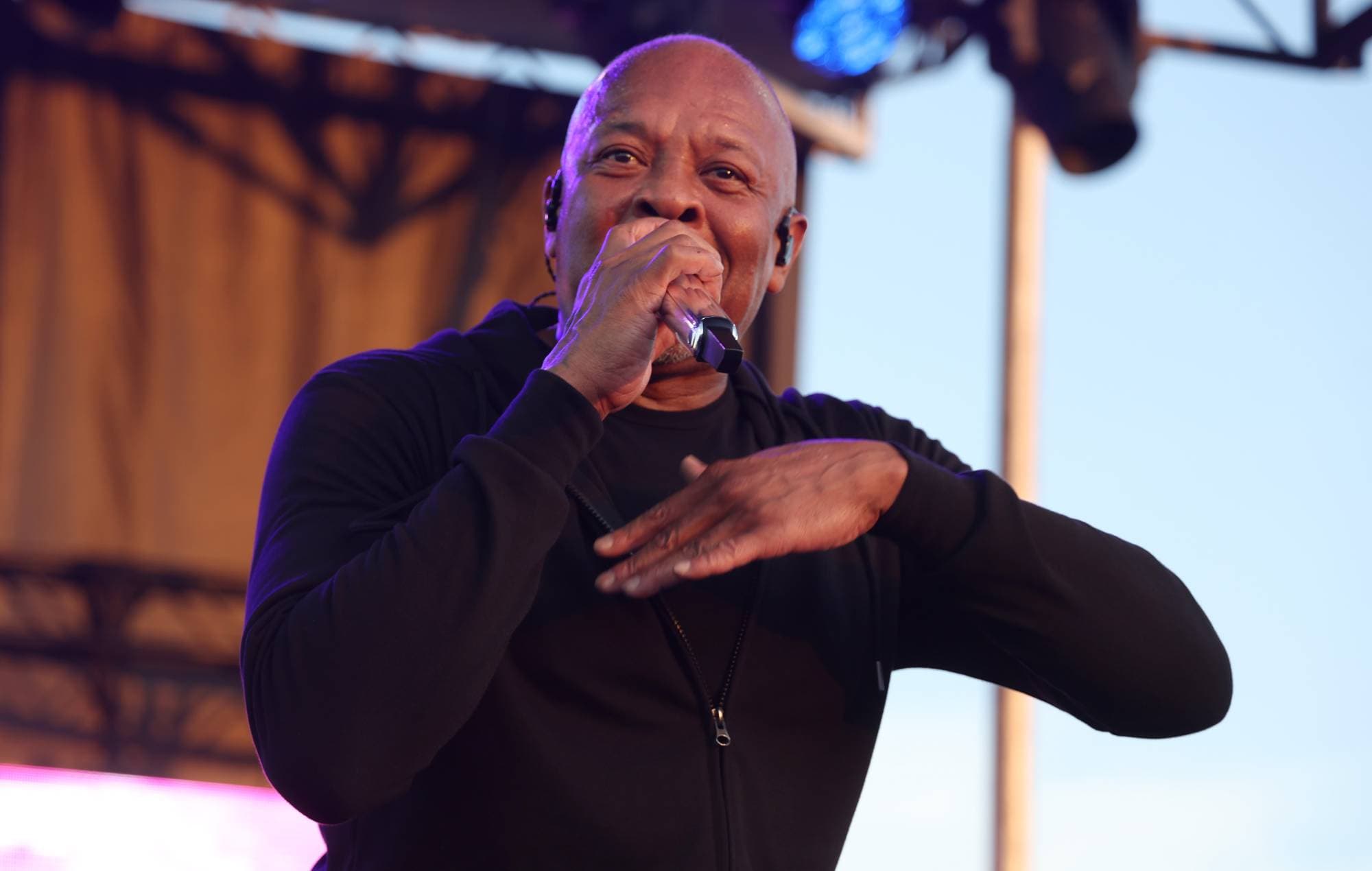 Dr. Dre performing live with a microphone at Coachella in 2012